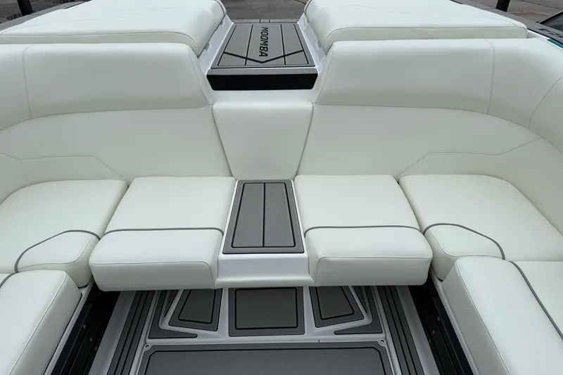 Slide: The Image of 2026 Moomba Max boat interior with white seating and sleek design. - 16