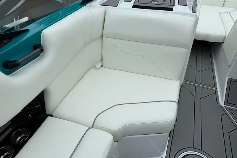 Slide: The Image of 2026 Moomba Max boat interior with white seating and modern design. - 19