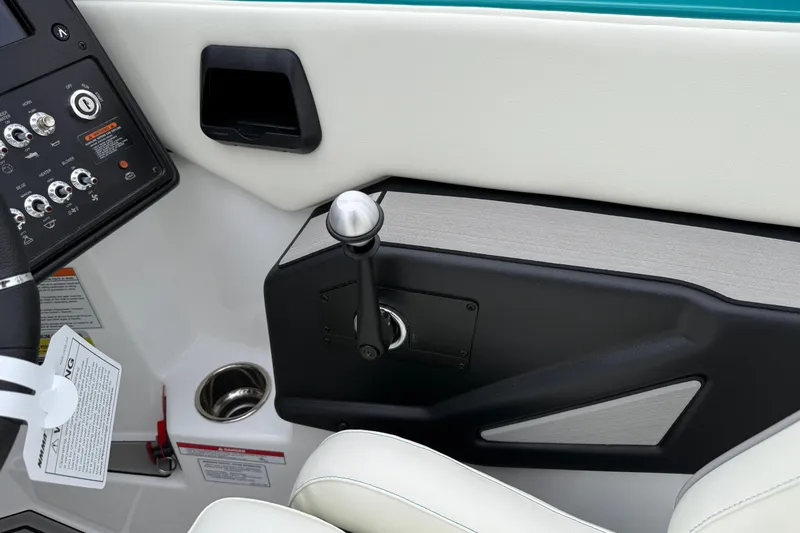 Slide: The Image of 2026 Moomba Max boat interior with control panel and throttle lever. - 22