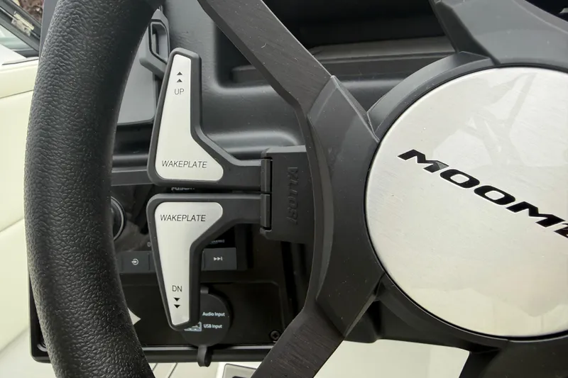 Slide: The Image of Steering wheel of 2026 Moomba Max boat with wakeplate controls. - 26
