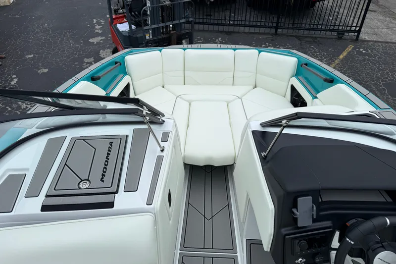 Slide: The Image of 2026 Moomba Max boat interior with white seating and modern dashboard design. - 27