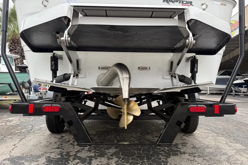 Slide: The Image of Rear view of 2026 Moomba Max boat on trailer, showcasing propeller and exhaust system. - 7