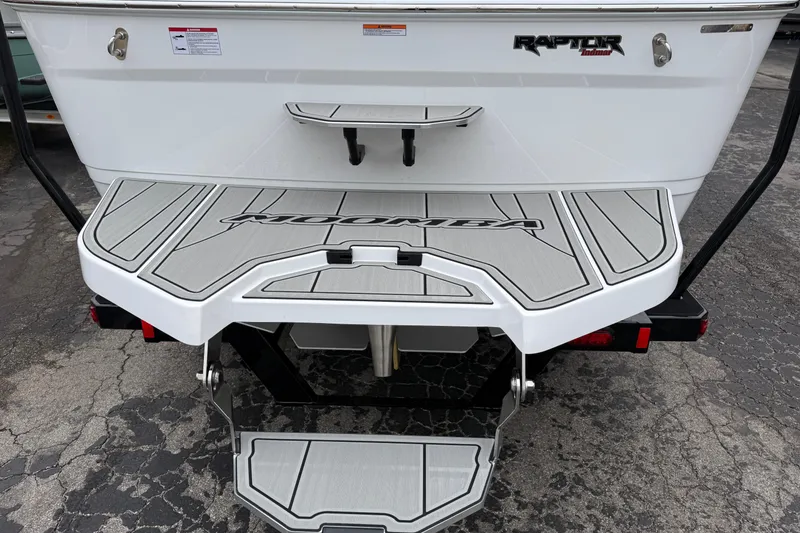 Slide: The Image of 2026 Moomba Max boat rear view with swim platform and Raptor Indmar engine. - 9