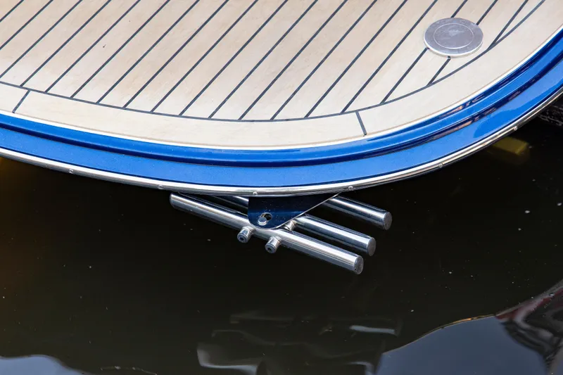 Slide: The Image of Sleek MJM 42 yacht stern detail, 2025 model, with polished metal fittings. - 13