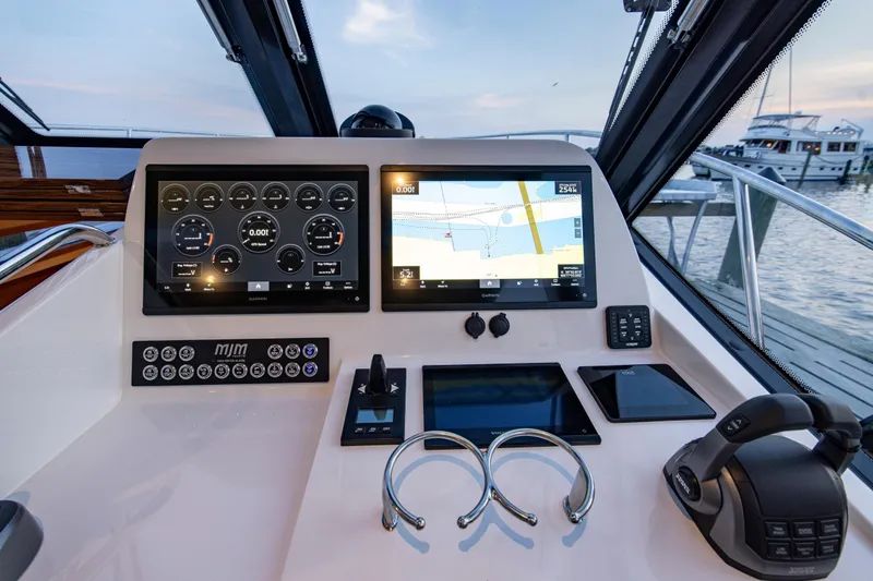 Slide: The Image of Helm of 2025 MJM 42 yacht with advanced navigation displays and controls. - 17