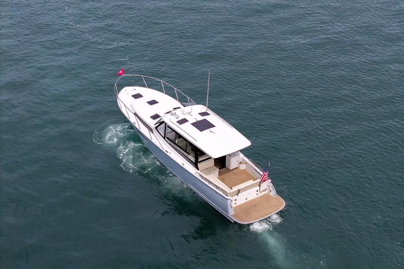 Slide: The Image of Aerial view of 2025 MJM 42 yacht cruising on open water. - 4