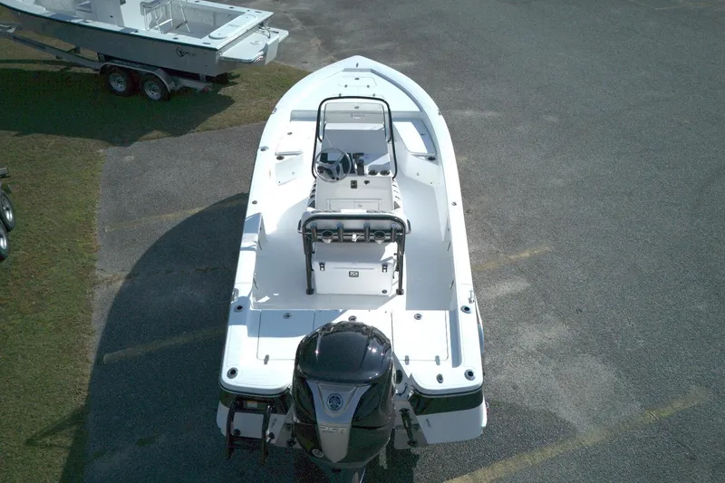 Slide: The Image of Aerial view of 2026 BlackJack 224 boat with outboard motor in parking lot. - 12