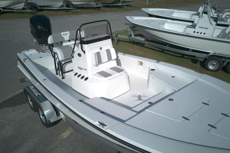 Slide: The Image of 2026 BlackJack 224 boat on trailer, featuring sleek design and spacious deck. - 14