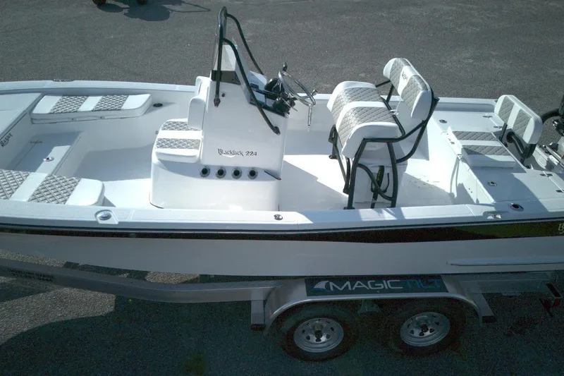 Slide: The Image of 2026 BlackJack 224 boat on trailer, featuring sleek design and comfortable seating. - 4