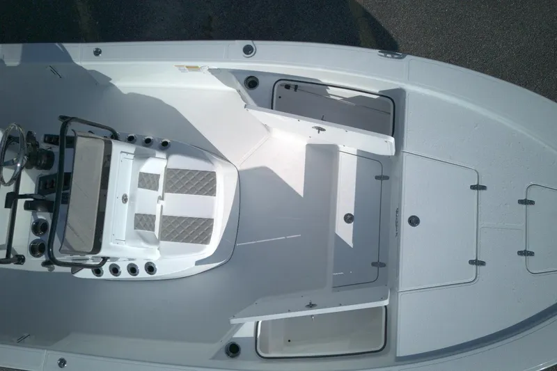 Slide: The Image of Top view of 2026 BlackJack 224 boat interior with open storage compartments. - 9