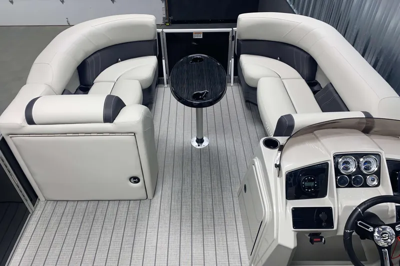 Slide: The Image of Luxurious interior of 2025 Sylvan 8 boat with plush seating and modern dashboard. - 10