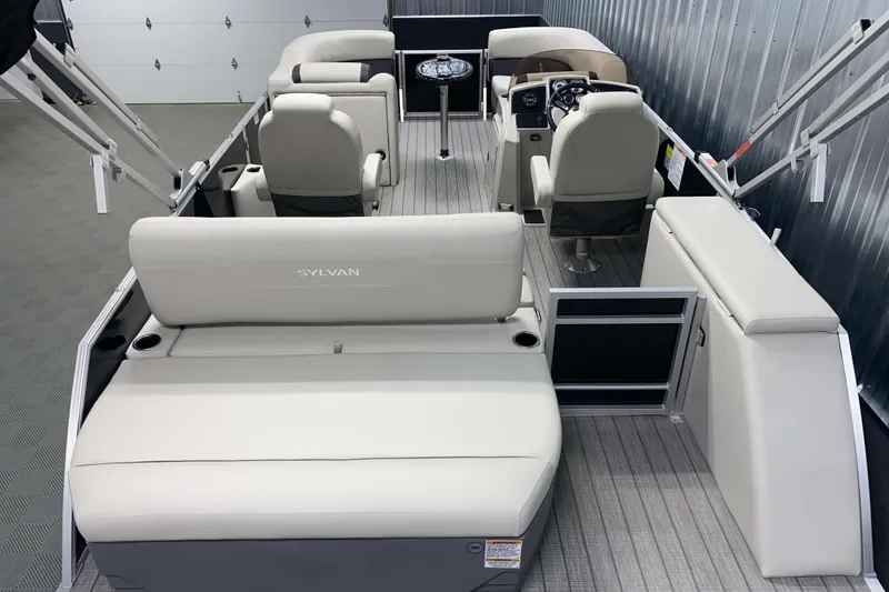 Slide: The Image of 2025 Sylvan 8 boat interior with modern seating and steering console. - 13