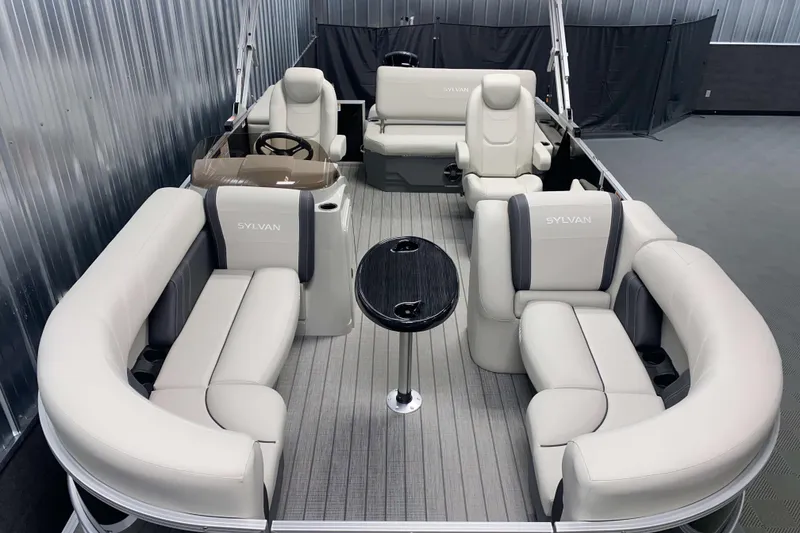 Slide: The Image of Luxurious 2025 Sylvan 8 pontoon boat interior with plush seating and sleek design. - 2