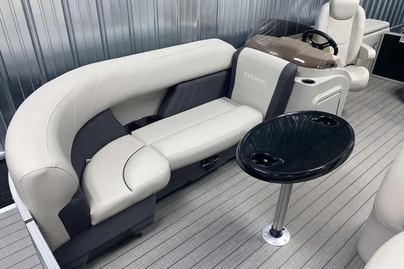 Slide: The Image of Luxurious Sylvan 8 boat interior, 2025 model, featuring plush seating and sleek table design. - 3
