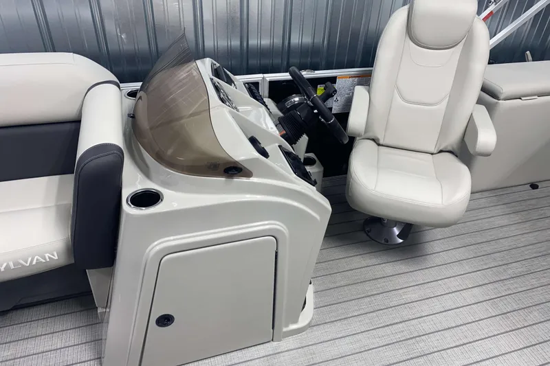 Slide: The Image of Interior of 2025 Sylvan 8 boat with steering console and seating. - 6