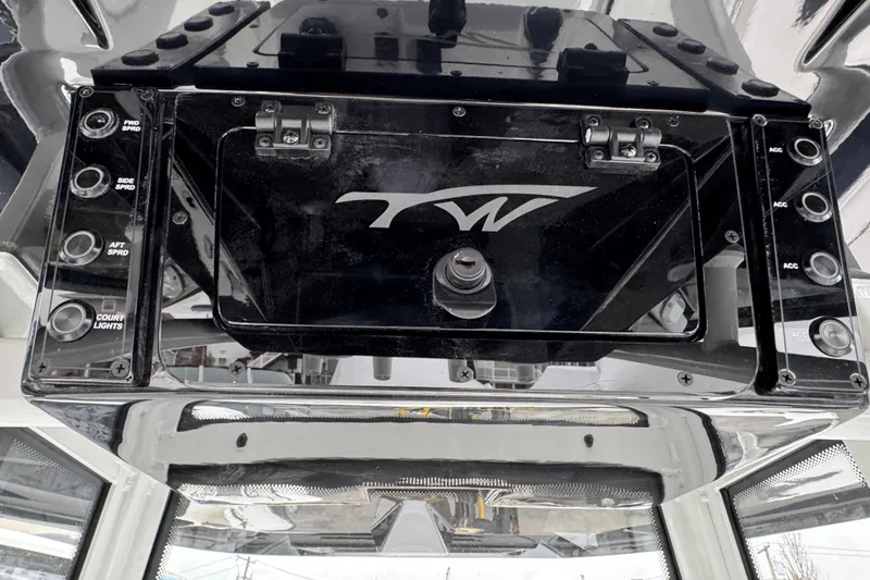 Slide: The Image of 2026 Tidewater 198 CC Adventure boat console with control panel and storage compartment. - 14