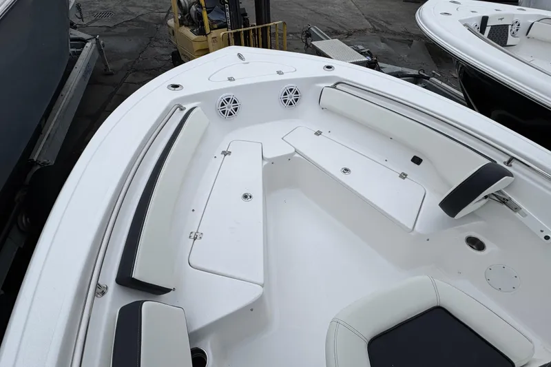 Slide: The Image of 2026 Tidewater 198 CC Adventure boat interior with seating and storage compartments. - 18