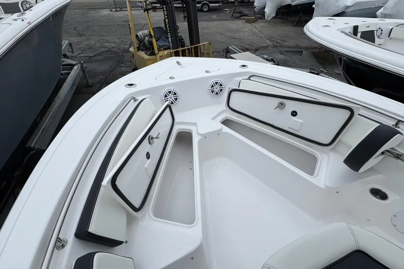 Slide: The Image of 2026 Tidewater 198 CC Adventure boat interior with storage compartments and seating. - 19