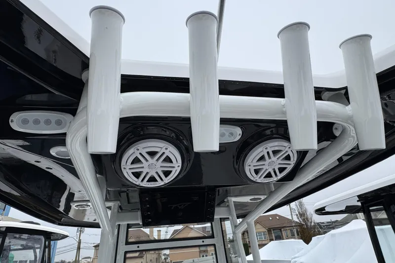 Slide: The Image of 2026 Tidewater 198 CC Adventure boat with rod holders and speakers on the T-top. - 5