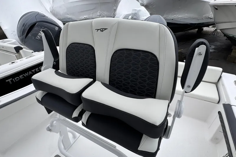 Slide: The Image of 2026 Tidewater 198 CC Adventure boat seats with black and white upholstery. - 8