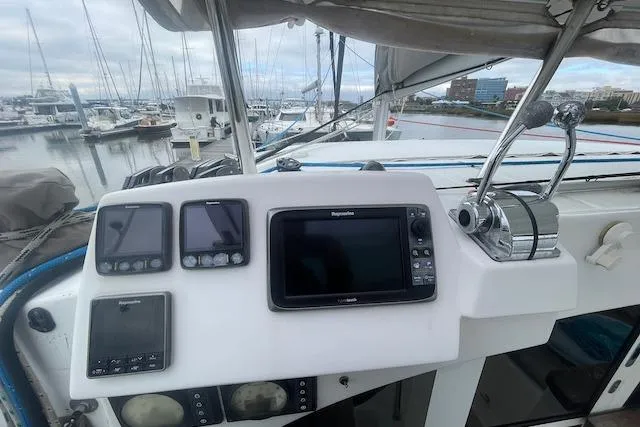 Slide: The Image of 2014 Lagoon 380 S2 catamaran deck with netting and seating area. - 17