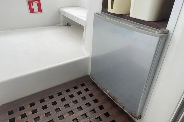 Slide: The Image of 2014 Lagoon 380 S2 catamaran deck with rigging and netting details. - 18