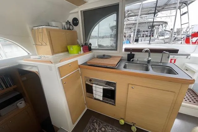 Slide: The Image of 2014 Lagoon 380 S2 catamaran deck with mast and rigging. - 22