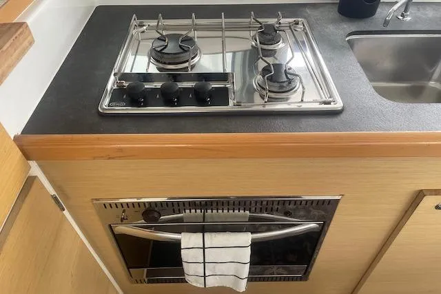 Slide: The Image of 2014 Lagoon 380 S2 yacht deck with mast and rope details. - 23