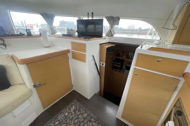 Slide: The Image of Deck view of 2014 Lagoon 380 S2 catamaran with railing over calm water. - 25
