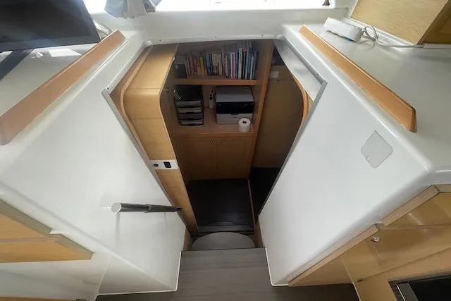 Slide: The Image of Interior of 2014 Lagoon 380 S2 catamaran with dining area and kitchenette. - 26