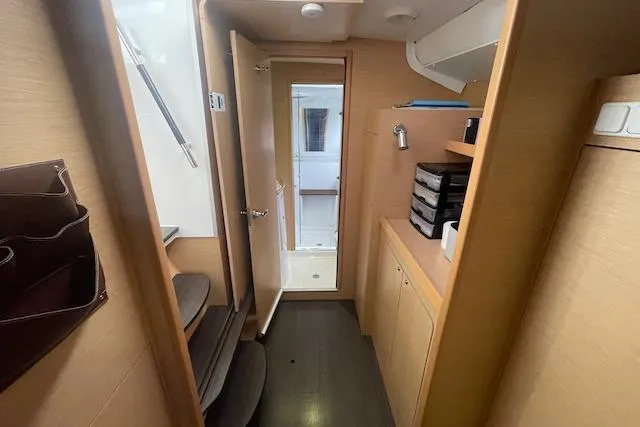 Slide: The Image of 2014 Lagoon 380 S2 yacht interior with cozy seating and modern kitchen. - 29
