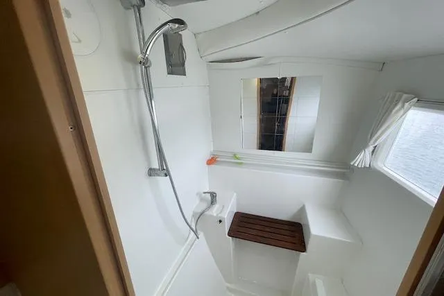 Slide: The Image of 2014 Lagoon 380 S2 yacht interior with cozy seating and dining area. - 31