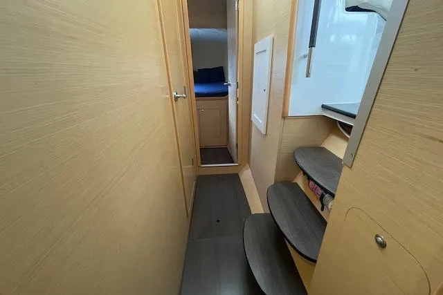 Slide: The Image of Interior of 2014 Lagoon 380 S2 catamaran with modern seating and dining area. - 36