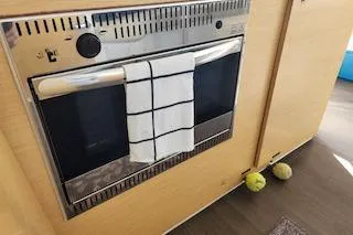 Slide: The Image of Built-in oven with towel in Lagoon 380 S2, 2014 model yacht interior. - 39