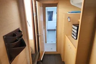 Slide: The Image of Interior of 2014 Lagoon 380 S2 yacht, featuring wooden cabinetry and modern design. - 41