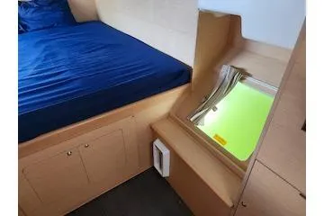 Slide: The Image of Interior cabin of 2014 Lagoon 380 S2 with bed and window view. - 44