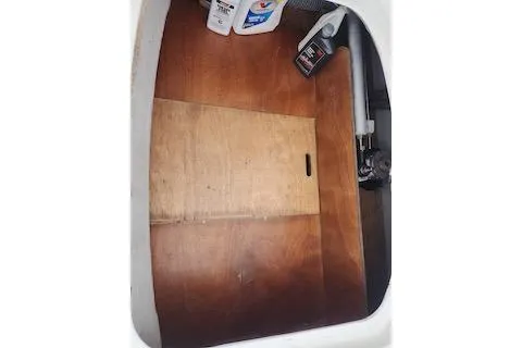 Slide: The Image of Storage compartment of 2014 Lagoon 380 S2 with cleaning supplies and tools. - 57