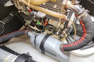 Slide: The Image of Engine compartment of a 2014 Lagoon 380 S2 catamaran, showcasing mechanical components. - 60