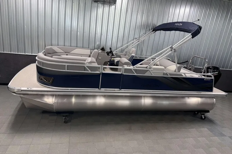 The Image of 2026 Avalon Venture 2185 VRB pontoon boat in showroom, featuring sleek design and modern amenities. - 1