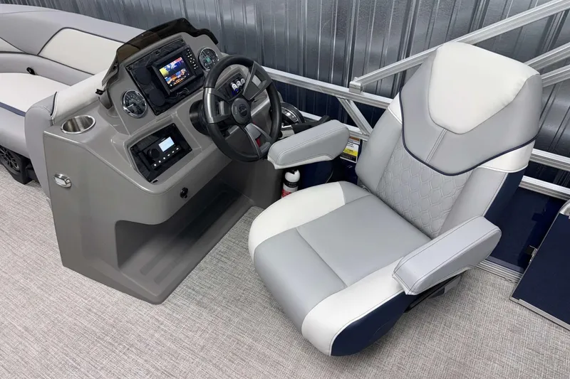 Slide: The Image of 2026 Avalon Venture 2185 VRB boat helm with modern steering and comfortable captain's chair. - 15