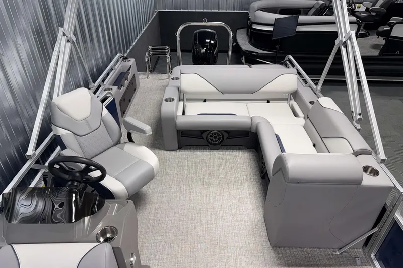 Slide: The Image of 2026 Avalon Venture 2185 VRB pontoon boat interior with modern seating and steering console. - 17