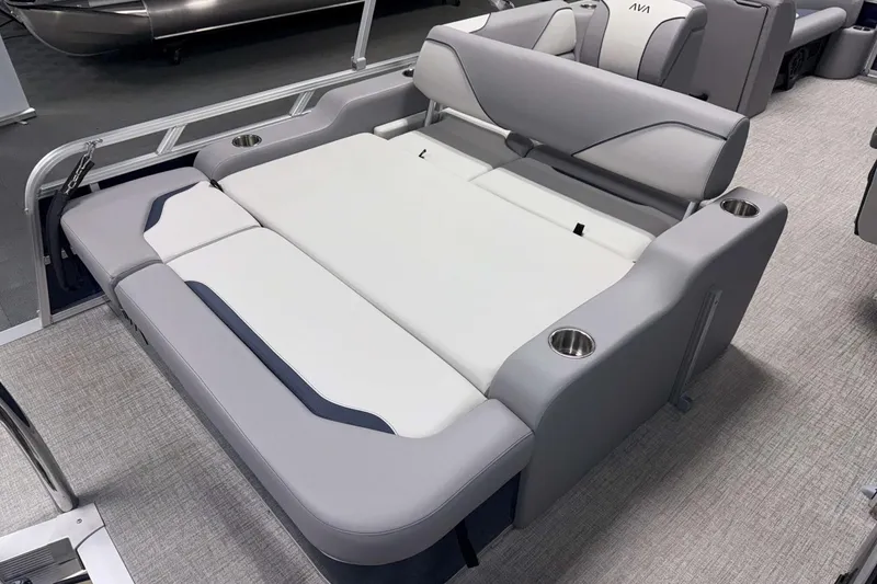 Slide: The Image of 2026 Avalon Venture 2185 VRB boat interior with gray and white seating, cup holders. - 19
