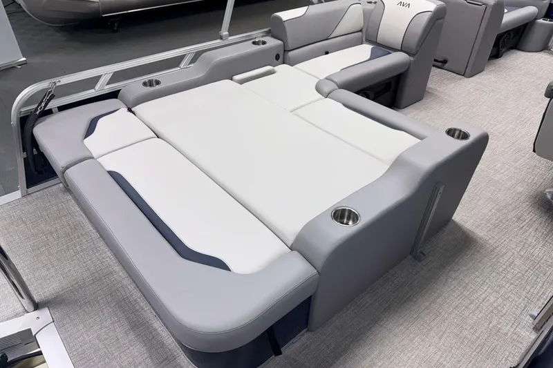 Slide: The Image of 2026 Avalon Venture 2185 VRB boat interior with gray and white seating and cup holders. - 20