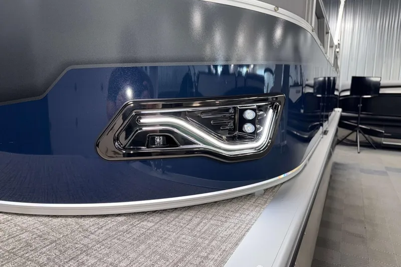 Slide: The Image of 2026 Avalon Venture 2185 VRB boat with sleek blue exterior and modern lighting. - 5
