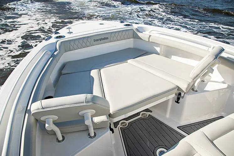 Slide: The Image of Manufacturer Provided Image: 2023 Everglades 235 Center Console boat with cushioned seating on the water. - 8