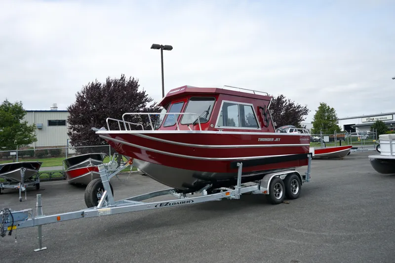 The Image of 2025 Thunder Jet 21 Chinook Pro boat on trailer, parked outdoors. - 0