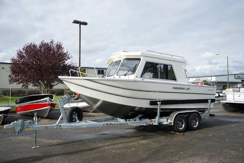 The Image of 2025 Thunder Jet 22 Alexis Pro boat on trailer, parked outdoors. - 0