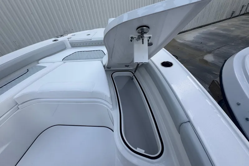 Slide: The Image of 2026 Blackfin 242 HB with Mercury Verado outboard engine on water. - 15