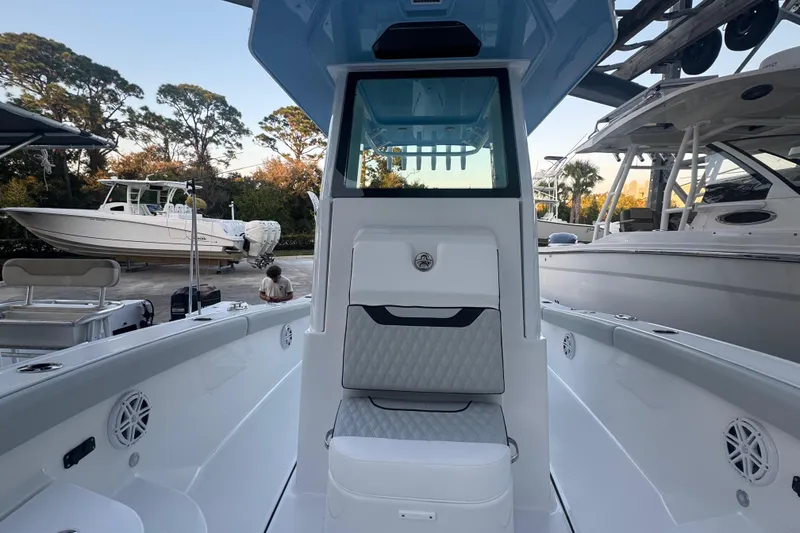 Slide: The Image of Luxurious seating on 2026 Blackfin 242 HB boat, with sparkling water backdrop. - 17