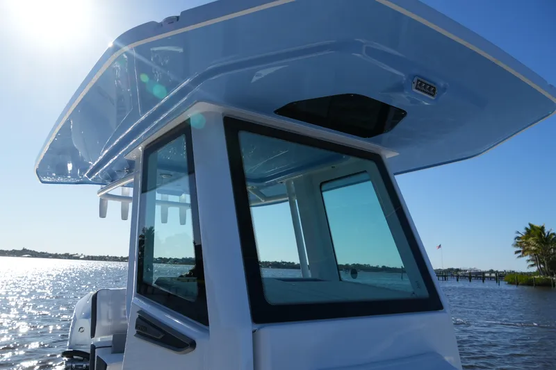 Slide: The Image of 2026 Blackfin 242 HB boat on water, sunny day, sleek design, modern features. - 25